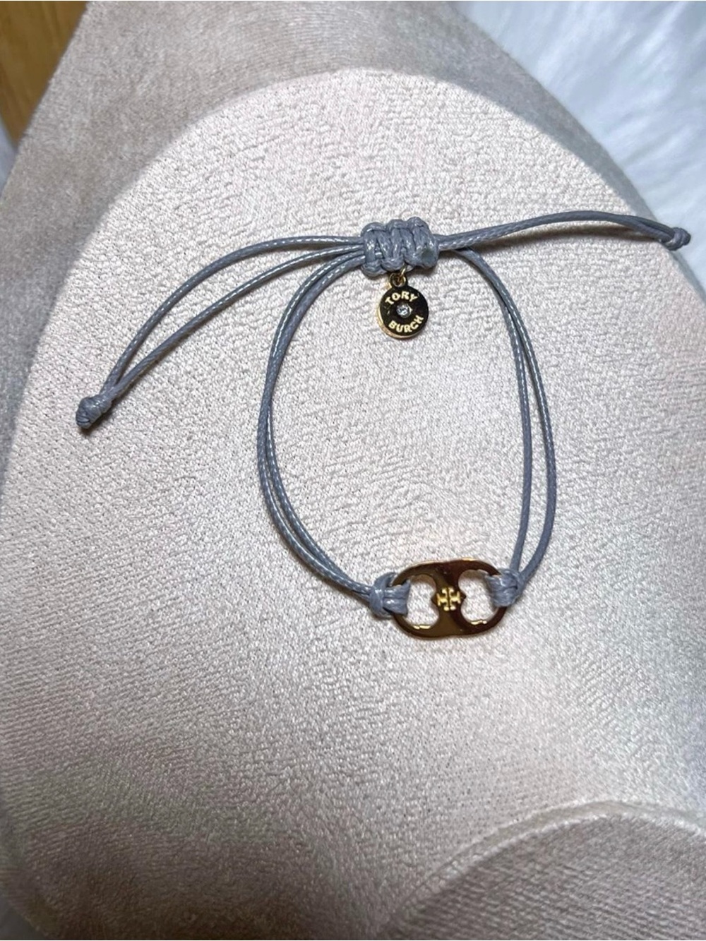 Tory Burch Light Gray Cord Bracelet with Gold Logo Charm